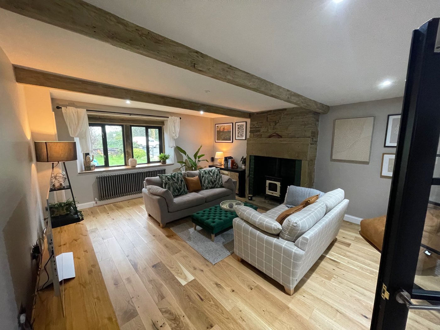 Beamed living room with stone fireplace